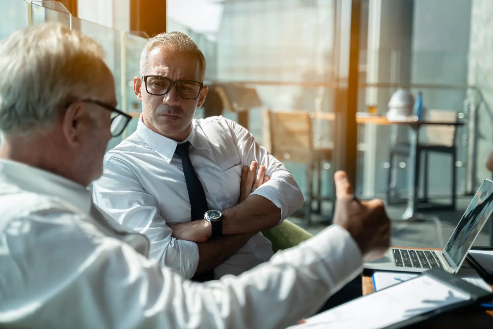 Business professionals in a consultative corporate sales meeting